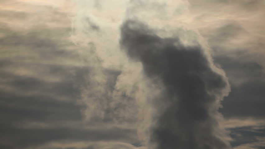 Heavy pollution, environment issues.. Smoke stakes against cloudy sky. 