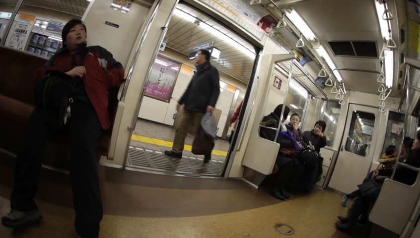 TOKYO - FEBRUARY 4: Unidentified passengers riding a subway train in Tokyo, Japan on February 4, 2011. Tokyo Metro is the most used subway system in the world in terms of annual passenger rides.