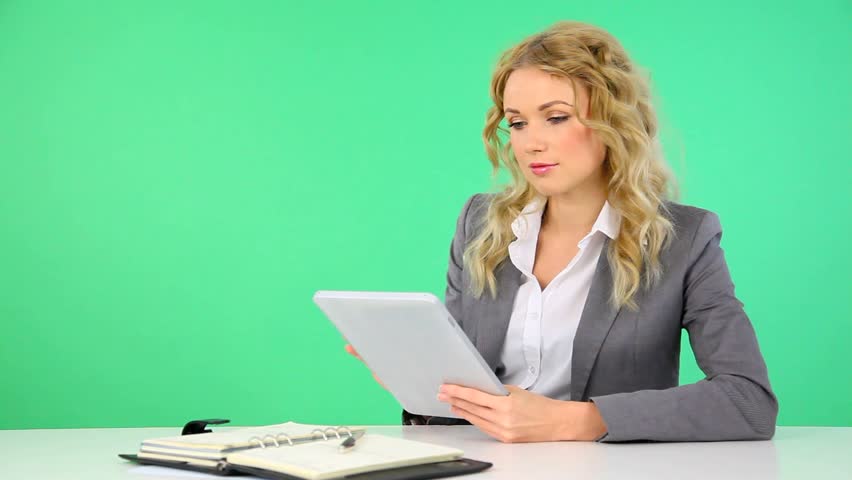 Businesswoman working on electronic tablet