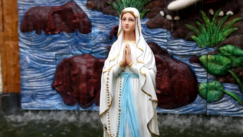 A praying virgin mary statue in worship