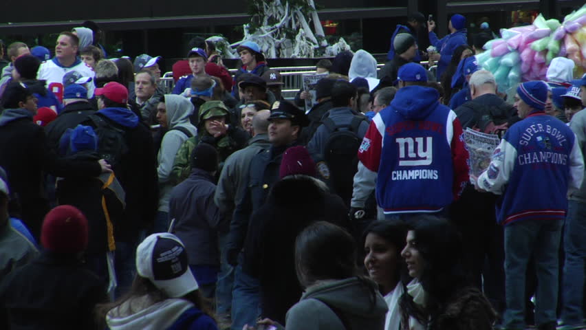 NEW YORK - FEBRUARY 7: Parade-goers scatter after the ticker-tape parade in honor of the Super Bowl Champions New York Giants on February 7, 2011 in New York. 