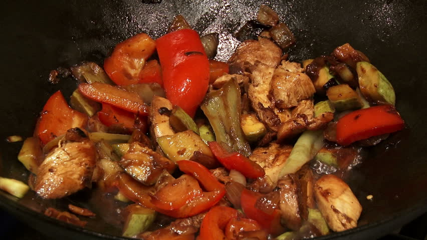 Chinese food in wok, mixing, 2 clips sequence