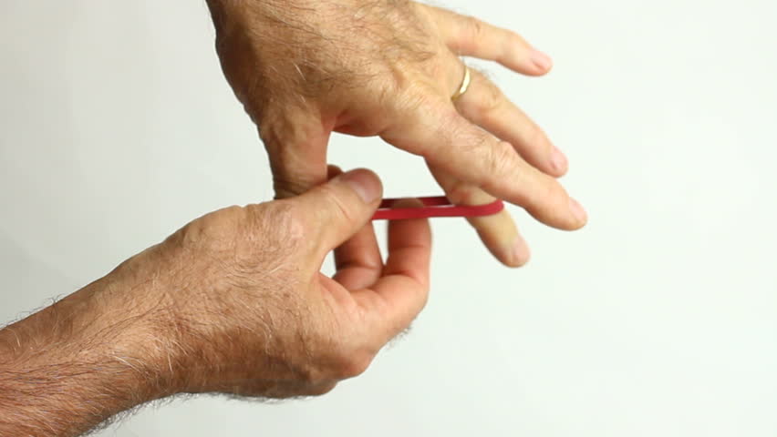 Businessman thinks, concentrates, procrastinates, while stretching rubber band. 1080p
