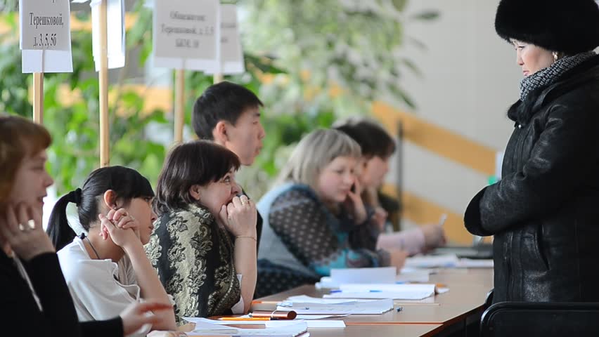 ULAN-UDE, RUSSIA - MARCH 4: The divisional election committee 699 of Burytia Republic register voters at the presidential election of Russian Federation on March 4, 2012 at a local polling station in Ulan-Ude, Buryatia, Russia.