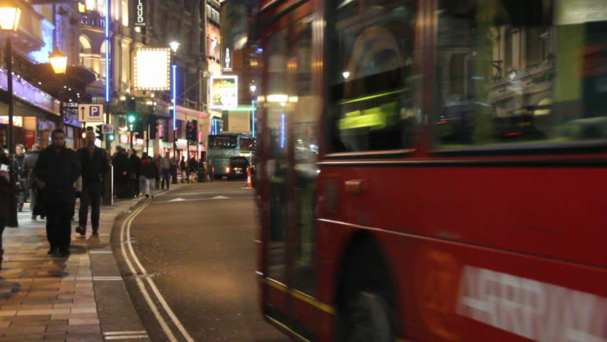 LONDON, UK - DECEMBER 28: Tourists, busses and other traffic on Shaftesbury Avenue drive by on December 28, 2011 in London, UK. Shaftesbury Avenue is the location of many theaters in London.