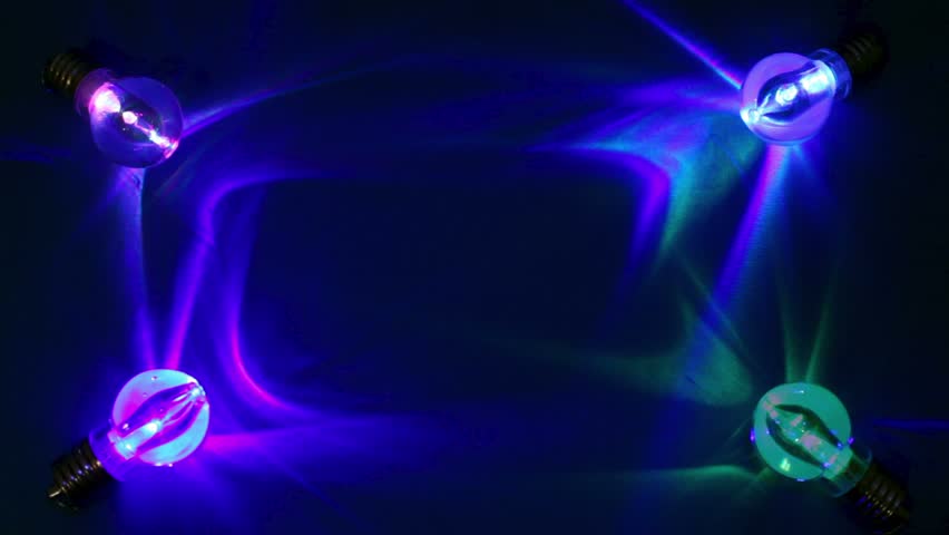 Four color light nano lamps lay at corners on cloth and flashes