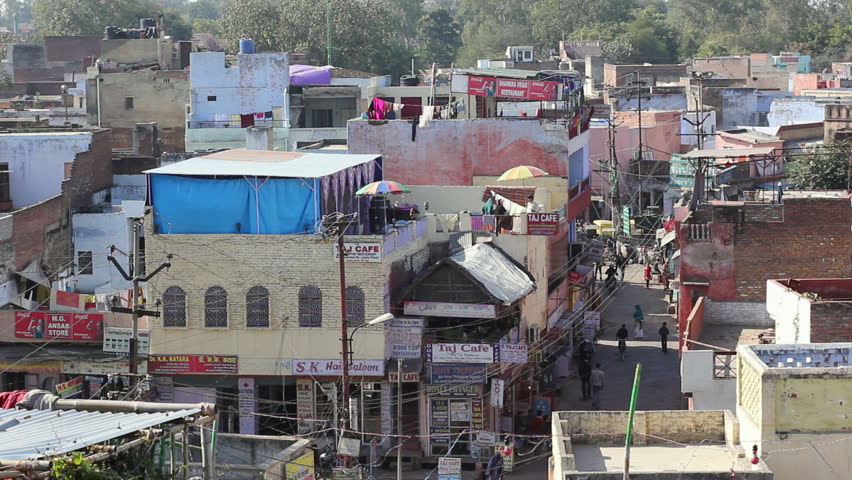 AGRA, INDIA - JANUARY 11: People walk the streets of Agra, Uttar Pradesh, India, near the Taj Mahal monument on January 11, 2011. 