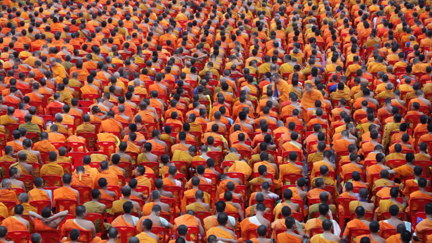 BANGKOK - MARCH 18: Monks are participating in a Mass Alms Giving of 12,600 monks in Central World for the Makha Bucha celebrations on March 18, 2012 in Bangkok, Thailand.