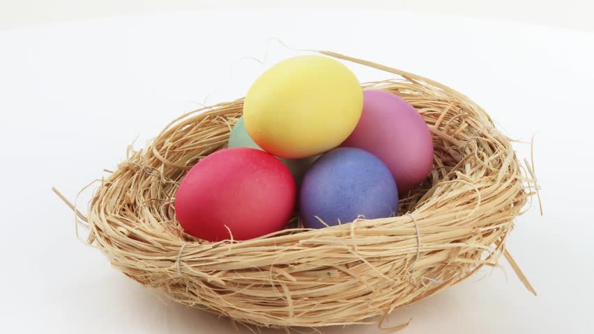 Coloured eggs in Easter nest
