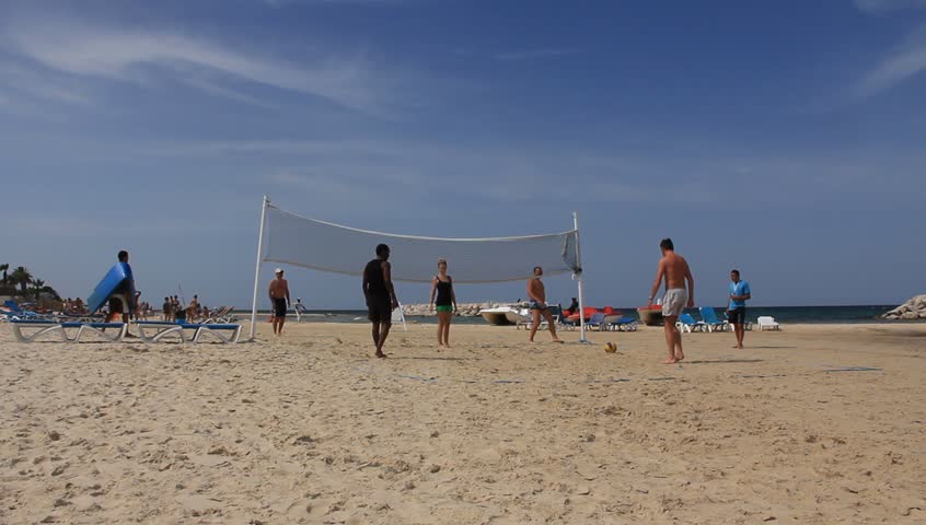 People playing volleyball on the beach in Sousse, Tunisia