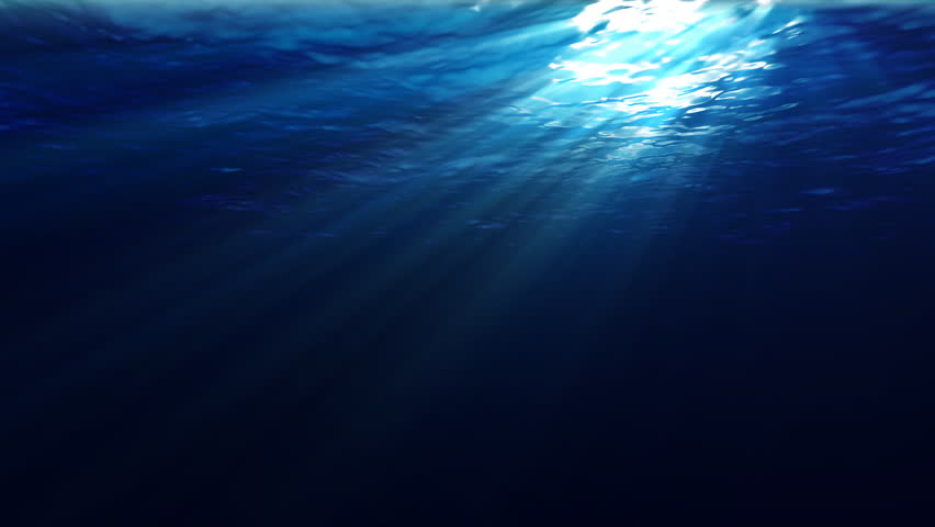 An underwater scene with sunrays shining through the water's glittering and moving surface. (Looping, Hight Definition 1080p)