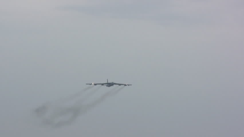 Air force cargo plane flying overhead.