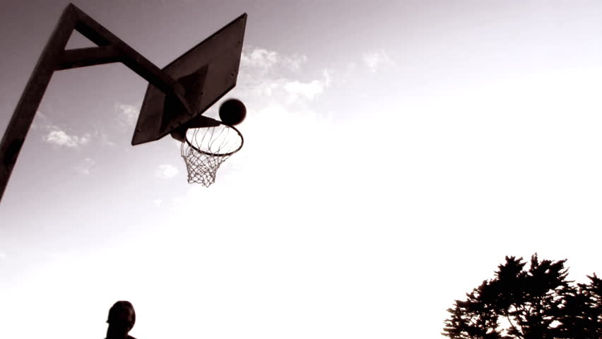 Basketball players dunking basketball in basket, London, UK. timelapse 