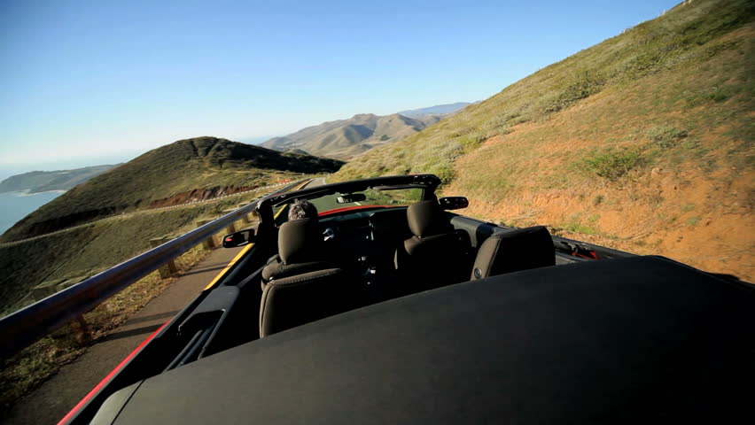 Time lapse of Luxury car road trip on winding Pacific highway