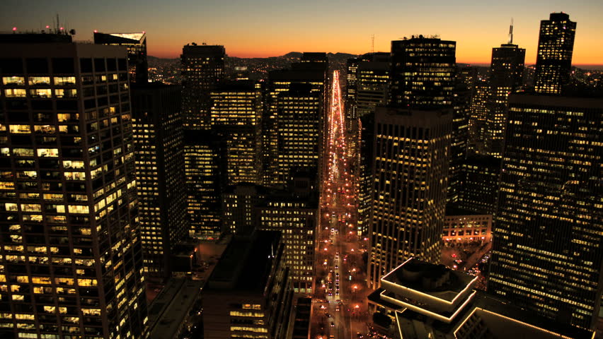 Aerial sunset low angled illuminated street view with San Francisco city skyscrapers, North America, USA