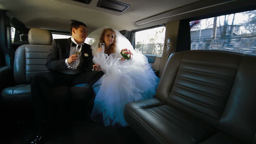 Just Married Young Couple Inside Limo