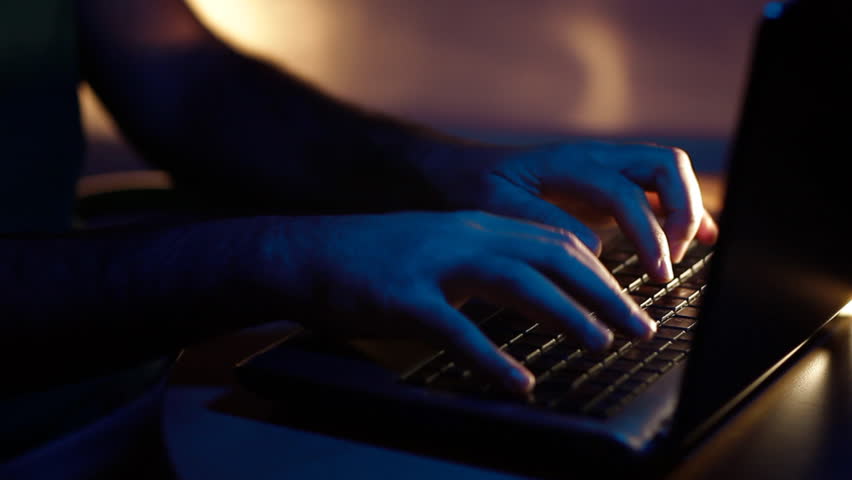 hacker typing on keyboard 1/4