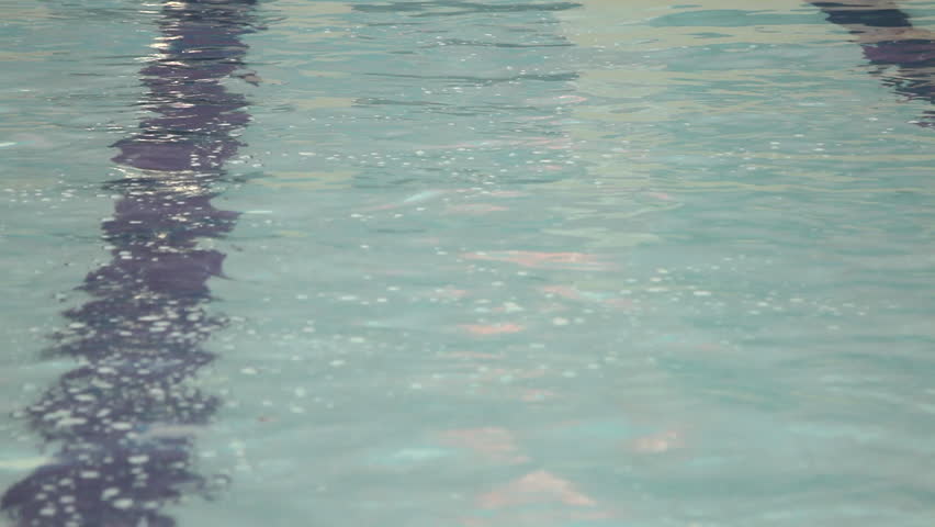 Male swimming in swimming pool in gym
