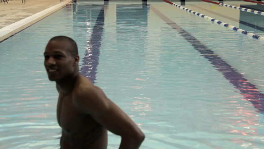 Male swimming in swimming pool in gym