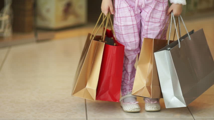 I love shopping. Little girl in the shop.