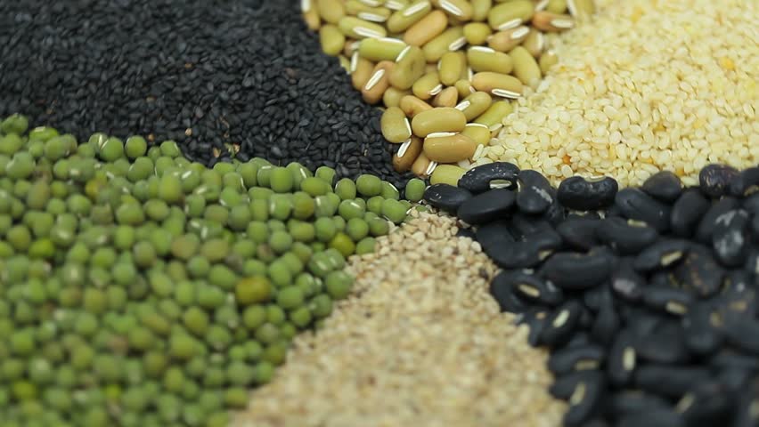 Nuts and sesame seeds in a circular motion.