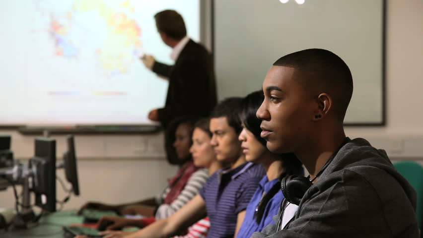 Students with teacher in computer classroom 