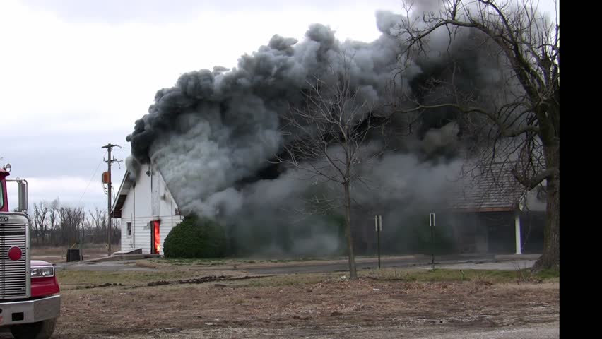 This building is engulfed in smoke before the fire breaks to the outside
