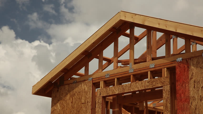 Abstract Clouds Time-lapse and New Home Construction Site Framing.