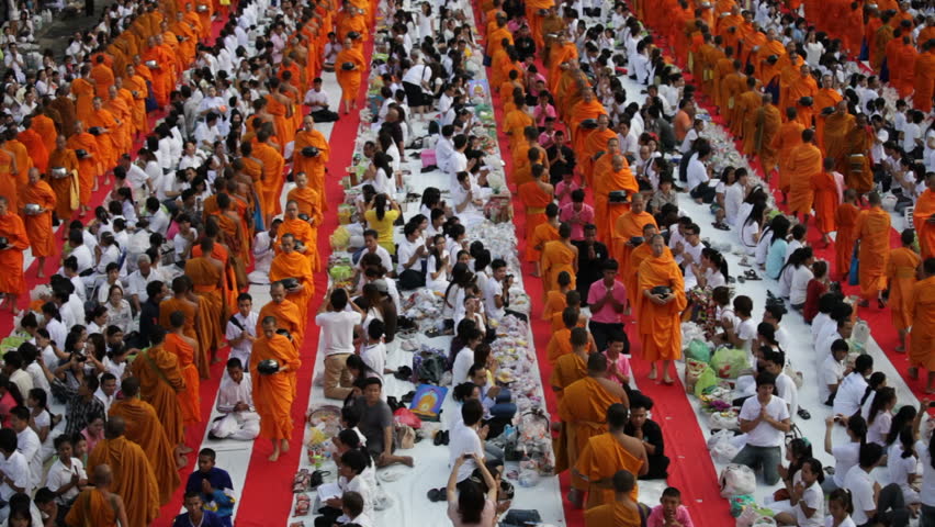 BANGKOK - MARCH 18: Monks are participating in a Mass Alms Giving of 12,600 monks for the Makha Bucha celebrations on March 18, 2012 in Bangkok, Thailand.