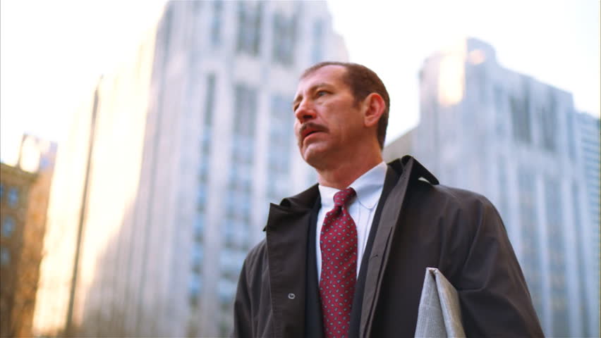 Businessman hailing a cab downtown
