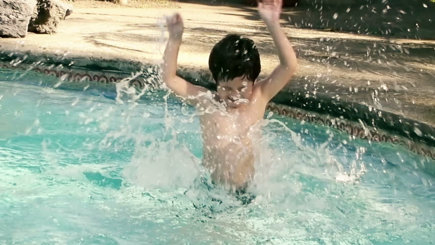 Kid Tantrum in Water Slow Motion (HD). Kid splashing with arms in shallow pool water; Hispanic origin; six years old. Slow motion captured at 60p and conformed to 30p. 