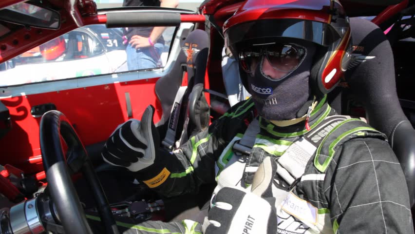 MOSCOW - JUN 11: Pilot sits in car salon, on 3rd stage of championship on drift Megafon-RDS 2011, on Jun 11, 2011 in Moscow, Russia