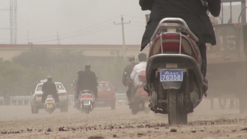 KASHGAR - 19 SEPTEMBER 2010: Traffic flows through the dusty streets of Kashgar, China 