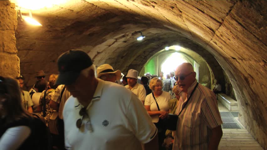 JERUSALEM - CIRCA 2010: Time lapse of tourists visiting the western wall tunnels circa summer 2010 in Jerusalem
