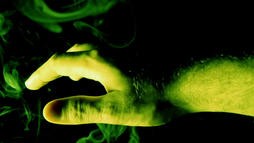 Mystical Hand with Green Smoke (HD). Green smoke engulfs a hand with green light gels to generate ambiance.