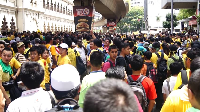 KUALA LUMPUR - APRIL 28, 2012: Protestors march during the Bersih 3.0 rally in Kuala Lumpur, Malaysia on April 28, 2012. The rally was organized by Coalition for Clean and Fair Elections to protest what they perceived as insincere election reforms.