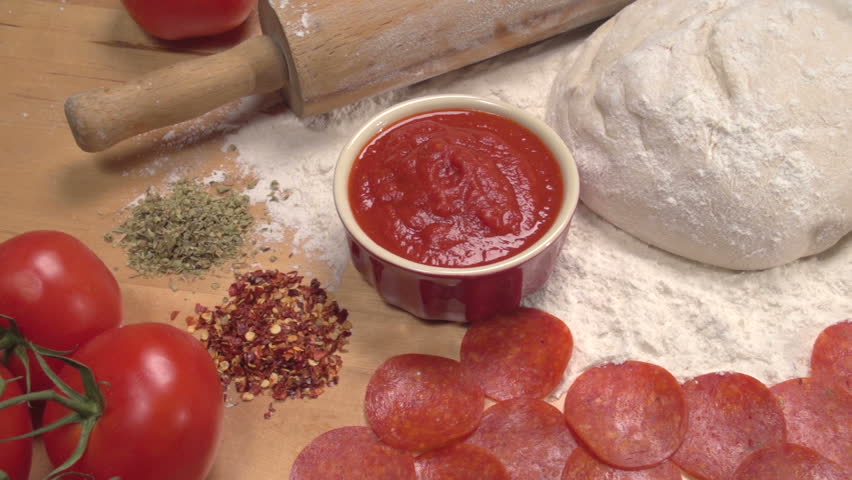 Dolly shot over fresh pizza ingredients