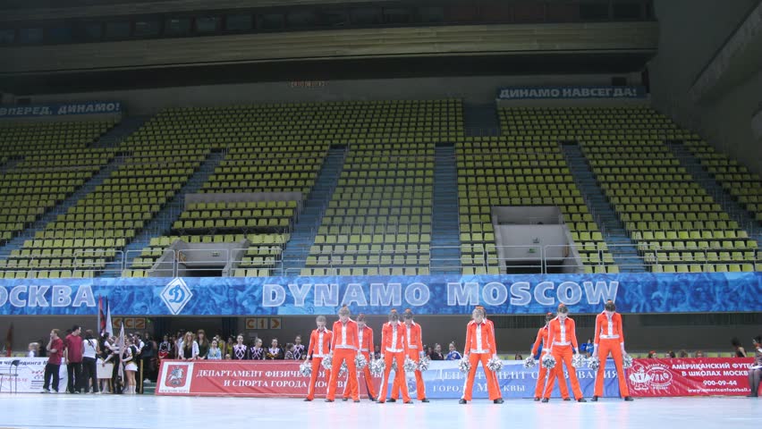 MOSCOW - MAR 24: (Timelapse View) Team in orange-dark blue suits participates in competitions of Championship of Moscow on cheerleading in Dynamo sports palace, on March 24, 2012 in Moscow, Russia