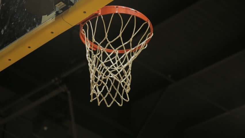shot of basketball going into the basket