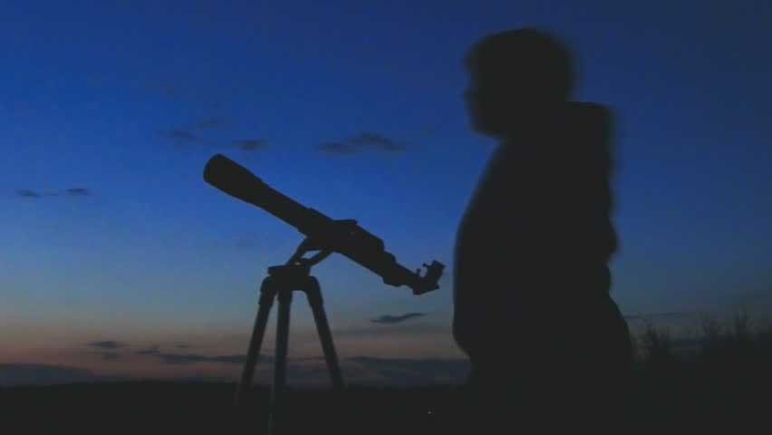 silhouette of telescope and astronomer