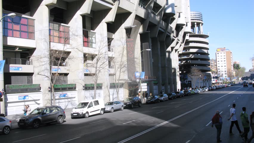 MADRID - MAR 11: (Timelapse View) Bus go on road near Santiago Bernabeu stadium, on Mar 11, 2012 in Madrid, Spain