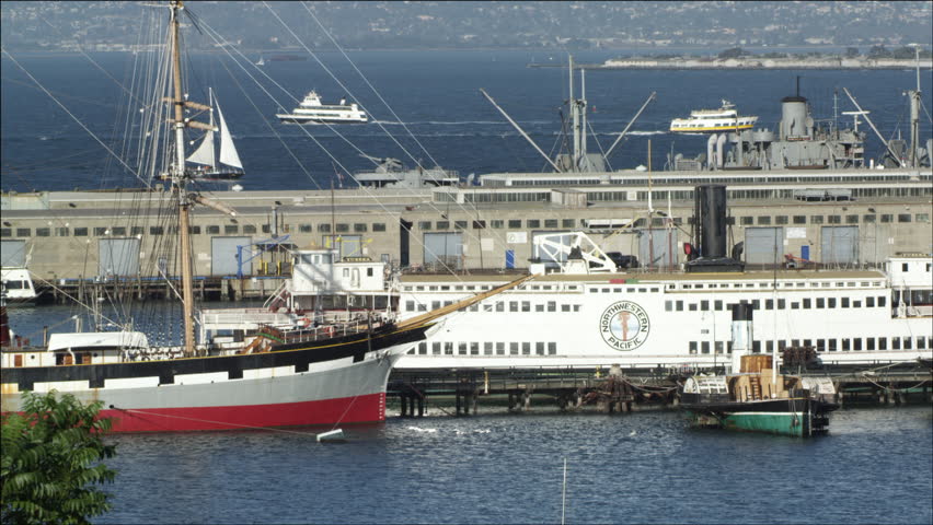 SAN FRANCISCO - CIRCA OCTOBER 2011: Northwestern Pacific and several fleets docked at Aquatic Cove Park as other boats sail by in the San Francisco Bay circa October 2011 in San Francisco, CA.