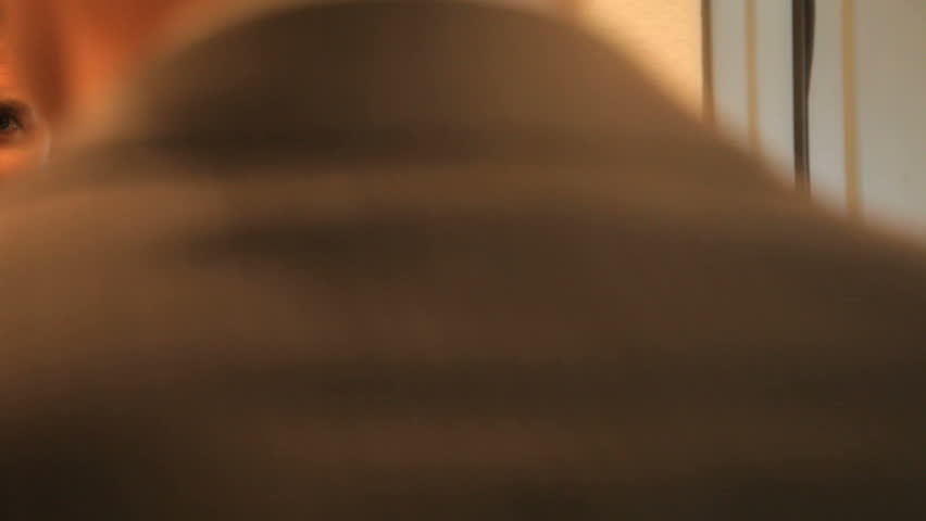 Business man with a positive attitude adjusting his tie in the mirror
