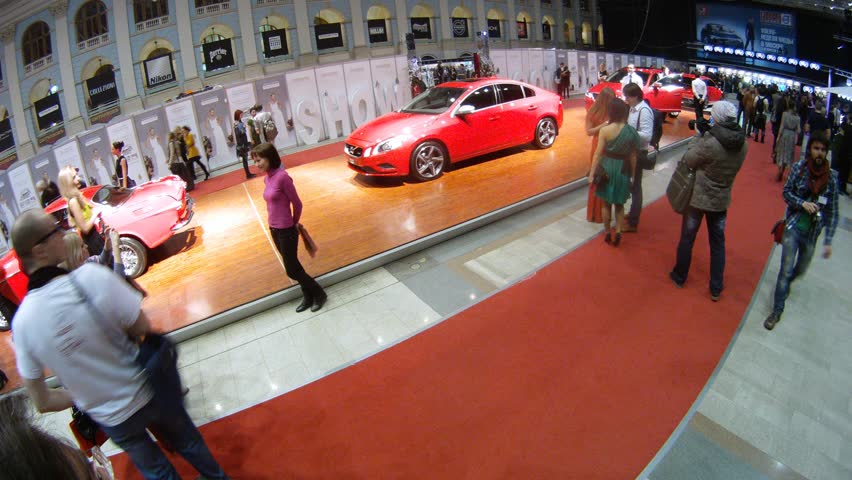 MOSCOW - APR 8: (Timelapse View) People are photographed with Volvo cars at exhibition VOLVO - Week of fashion in Moscow in Gostini dvor, on April 8, 2012 in Moscow, Russia