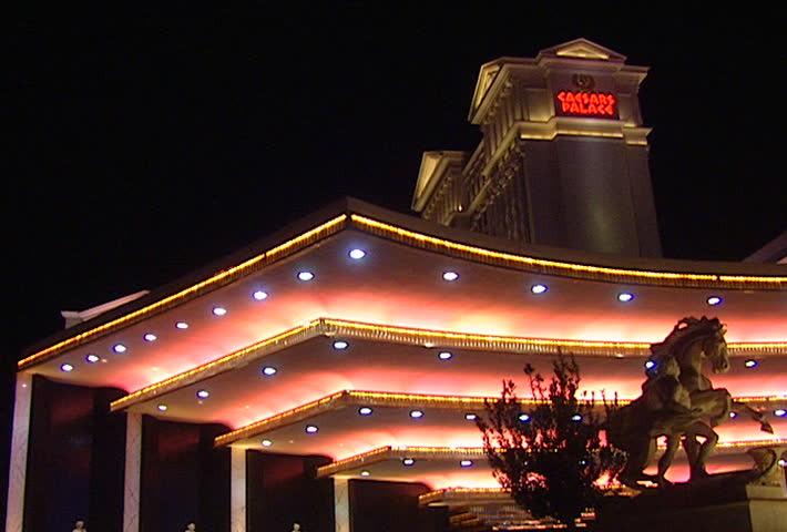 LAS VEGAS - Circa 2002: Caesars Palace loading area at night, limo drives through