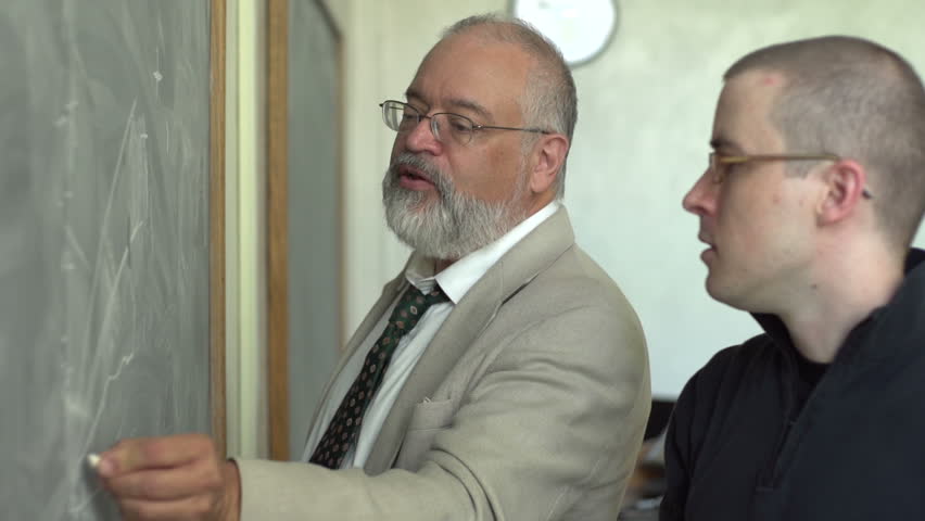 Professor and student working at the chalkboard
