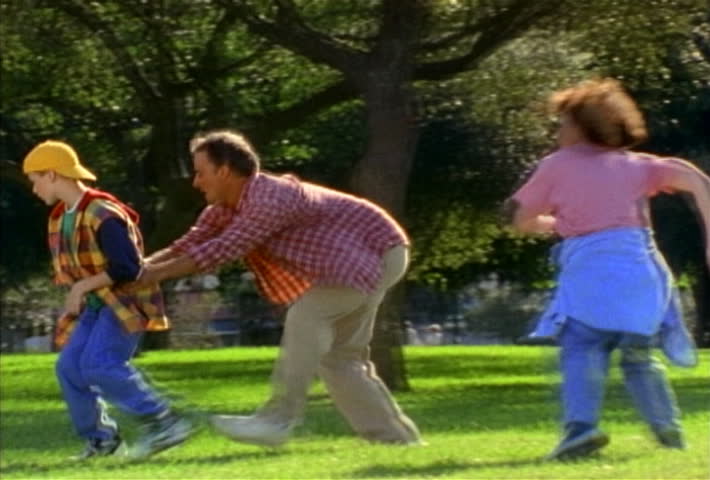 Family playing soccer