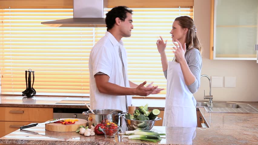 Young couple arguing in the kitchen