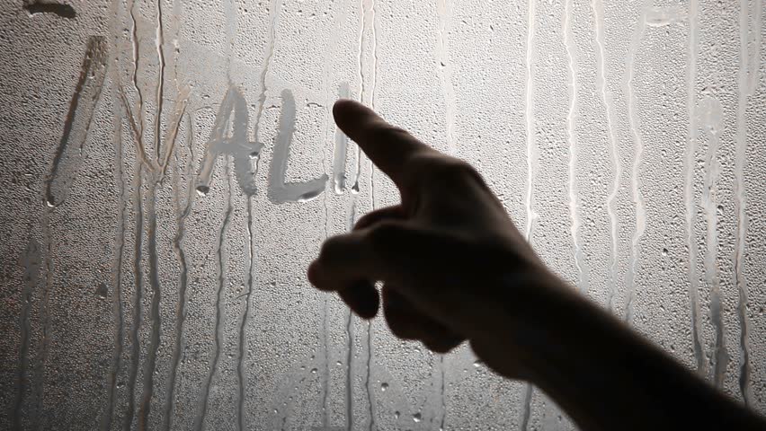 Writing "Valentine" on steamy window