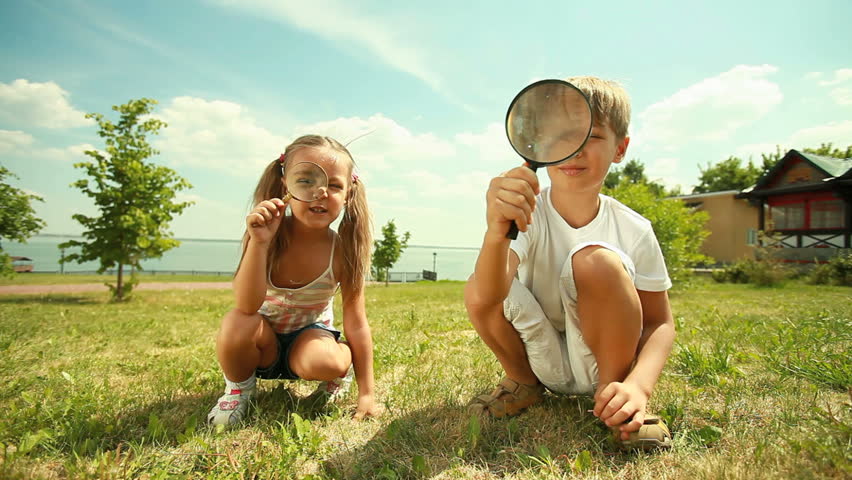 Young naturalists spending time outdoors looking for objects of research
